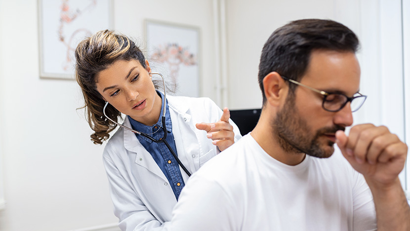 doctor checking liberty university employee breaths after being sick