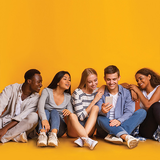 collaborative health pediatrics teens hanging out looking at phone