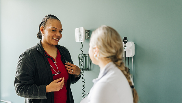 primary care nurse showing patient test results in lynchburg virginia doctors office